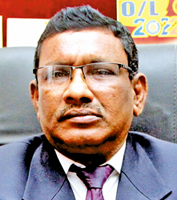 Principal Amaraweera 
M. Mudalige