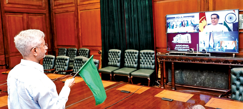 Indian External Affairs Minister Dr. S. Jaishankar watches a live stream of the event