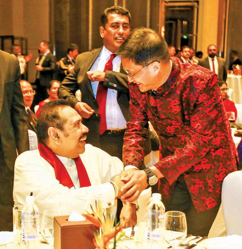 Chinese Ambassador Qi Zhenhong in conversation with former
President Mahinda Rajapaksa