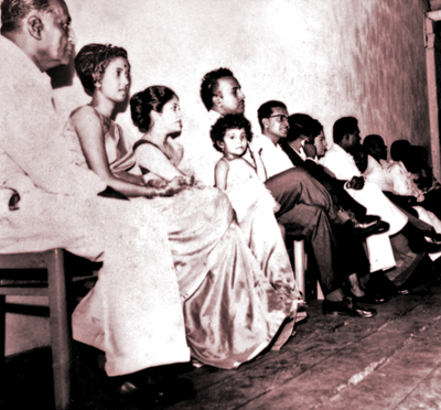 Vilasnee, flanked by her parents, Rita and Robin Tampoe, and her grandfather, WMS Tampoe (extreme left)