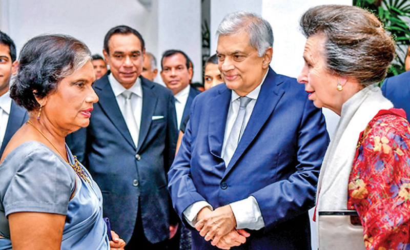 Princess Anne engaged in a friendly conversation with Former President Chandrika Bandaranaike Kumaratunga