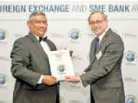 Commercial Bank’s Deputy General Manager,  Personal Banking,  Delakshan Hettiarachchi receives the award on behalf of the Bank.