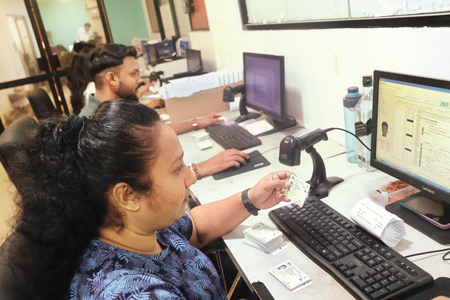 The hard-working officials of the Motor Traffic Department, Werahera.  Pix: Wasitha Bulathsinhala