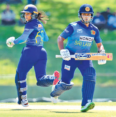 Chamari Atapattu (right) and Vishmi Gunaratne run between the wickets during their 93-run opening stand that set the course for victory