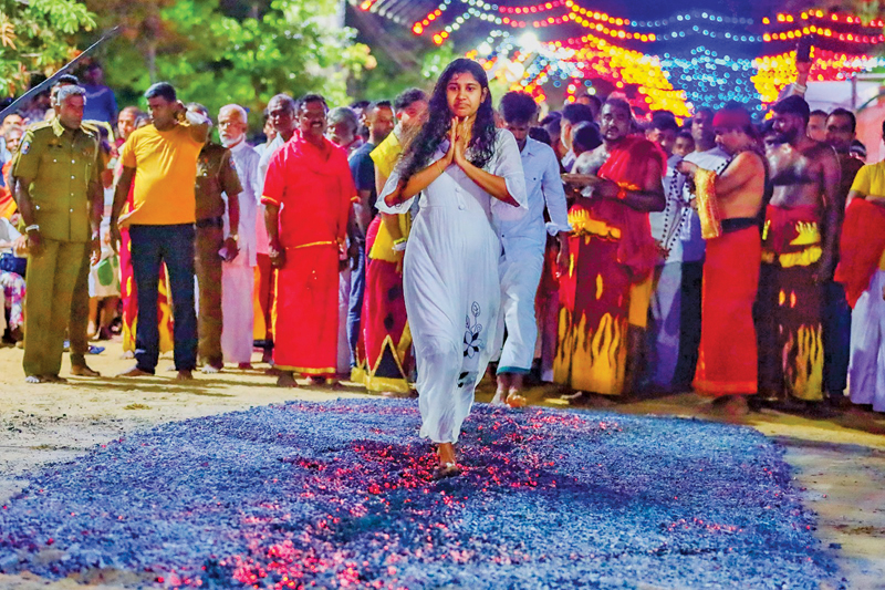 The fire-walking ceremony of the Kataragama Esala festival took place on Friday (July19) morning in front of the Ruhunu Maha Kataragama Devalaya. Here the devotees take part in the fire walking. Nearly 345 devotees participated in this year’s ceremony.   Picture by Sulochana Gamage