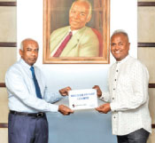 Managing Director, Tokyo Cement Company, S. R. Gnanam presents the 2024 Cricket Coaching Academy sponsorship to Founder/Chief Trustee, Foundation of Goodness, Kushil Gunasekera.