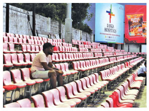 Night time or floolit rugby unlike cricket does not appear to attract much spectators as a lone fan sits at an empty stand at the Havelocks versus Police SC match at Havelock Park yesterday.