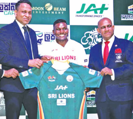 Captain of Sri Lions Kevin Dixon (centre) displays his team’s jersey at its launch on Thursday in the presence of commecial partner Aelian Gunawardene the Managing Director of JAT Holdings (left) and the club’s owner and founder Kelum Perera