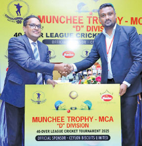 Vijith Nishantha (right) presenting the sponsorship cheque to Mahesh de Alwis president of MCA