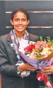 Darshani Chandraratne poses with her medals