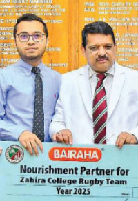 Shafraz Hussaindeen, Financial Controller Bairaha Farms PLC presenting the sponsorship to the Principal of Zahira College Trizvy Marikkar