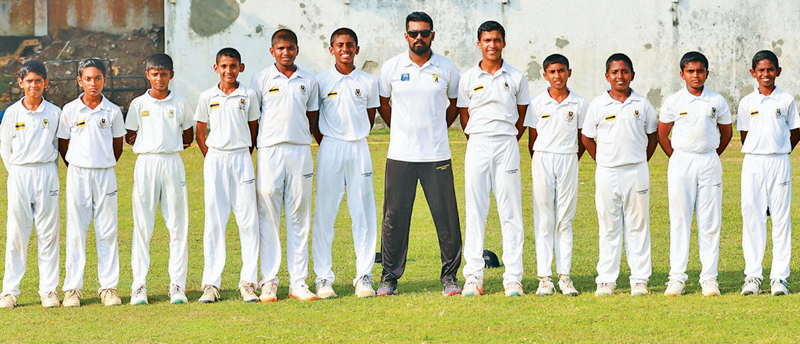 With his Assistant Coach and team mates. Pix: Dushmantha Mayadunne