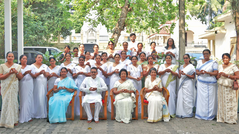 Members of Viruliya Sevana, an organisation of retired female officers of the Armed Forces, organised a spiritual event to coincide with International Women’s Day at Heenatikumbura Rajamaha Vihara, Battaramulla yesterday. In the picture members wishing all the people worldwide to be free from war, famine and pestilence, the Three Fears (Thun Biya) described in Buddhist literature. Seated from left: Lt. Col. Kumudini Muthaliff (retd), Dr. Priyantha Nawarathna, Ramya Weerakoon (patron) and President of Viruliya Sevana, Major Ramani Bandara (retd).