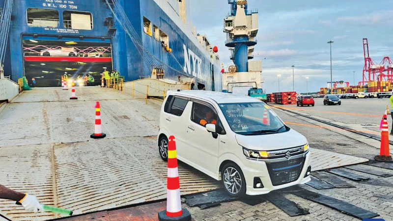 Vehicles being unloaded at the Hambantota Port yesterday, following the end of the import ban on private vehicles. - Xinhua