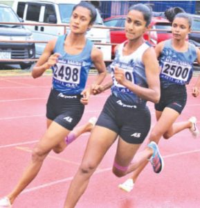 Dulanjana Pradilani of Lyceum (left) during the 1500m race